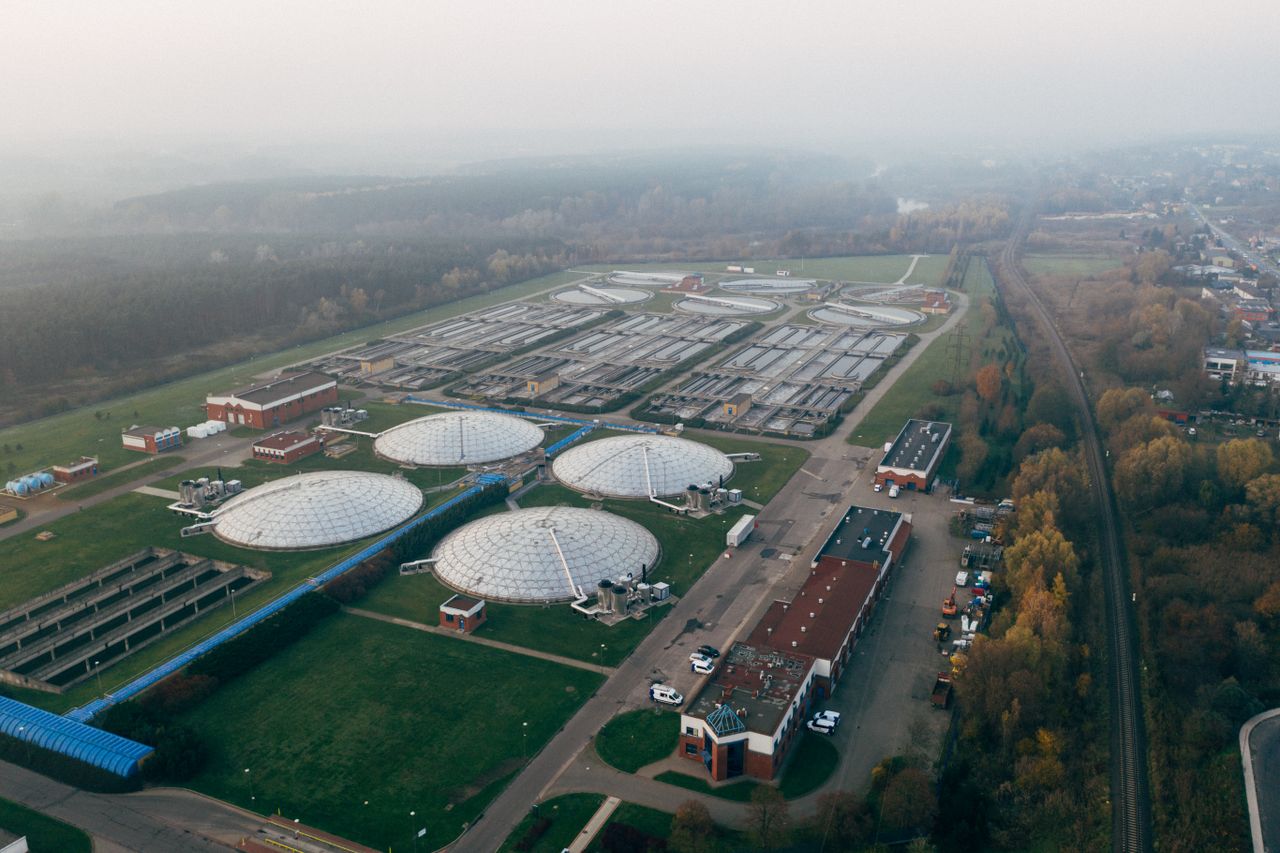 Aerial shot of a wastewater treatment facility in Poznań, showcasing industrial technology and environmental effort.